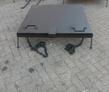 Grey industrial steel manhole cover and frame set by Amescon